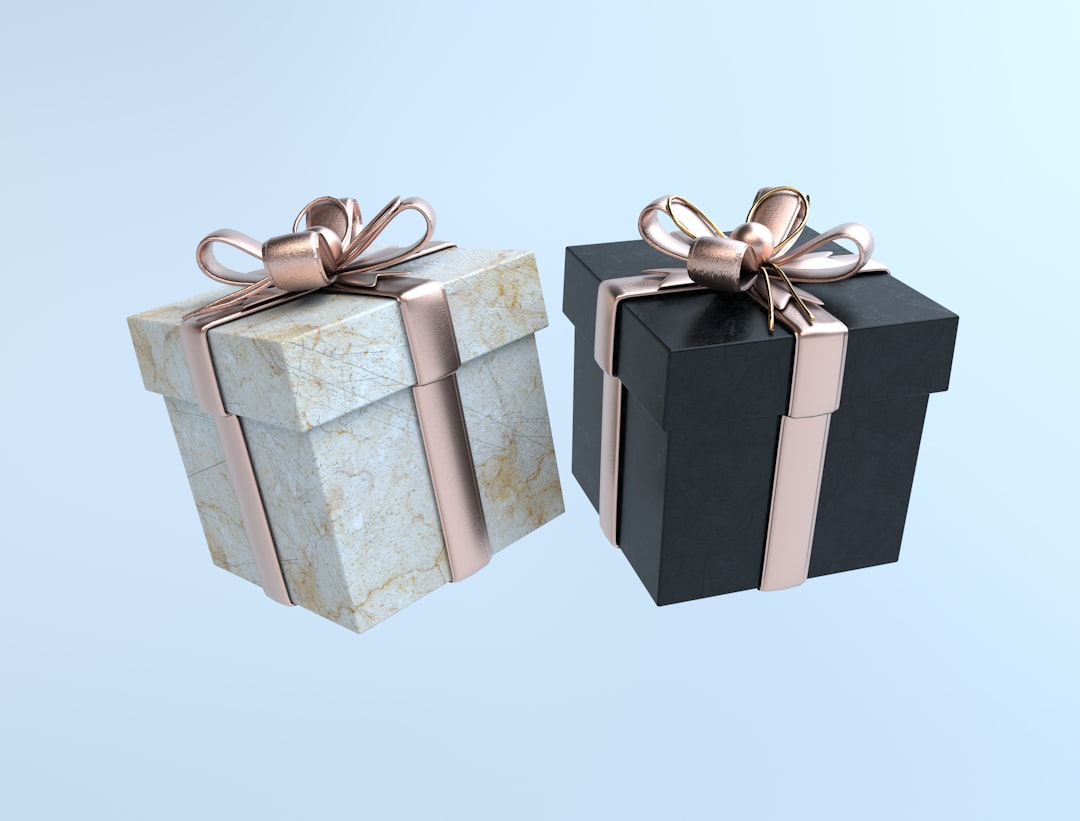 Two elegantly wrapped gift boxes with decorative bows on a light blue background.